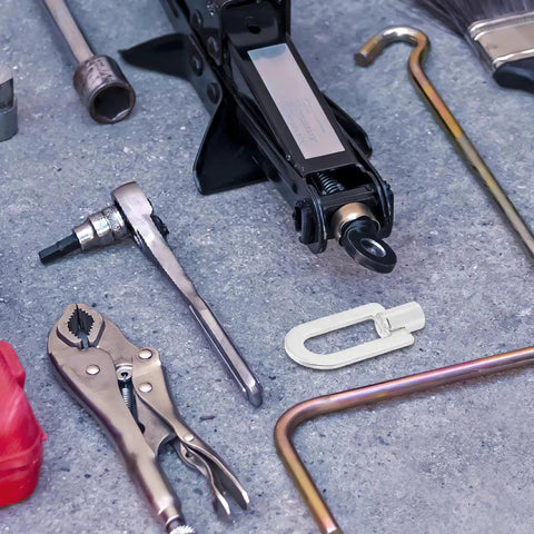 Three Piece Aluminum Dent Puller Ring Kit For Auto Body And Sheet Metal Repair next to hand tools on garage floor