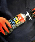 Heavy Lifters Expanding Spray Foam Sealant Fills Gaps And Cracks Straight Up, 12 Oz tube held by gloved hand.