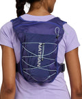 Back view of 15L Go To Hydration Pack Indigo And Reflective Silver OSFM One Size Fits Most Unisex Running Backpack worn by person