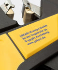 Close-up of Ergonomic Automatic Wire Stripper for AS-Interface Cables with PUR or TPE insulation showing blades and branding