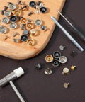 Collection of metal studs and screws from Snag This Solid Twenty Six Piece Purse Feet And Handbag Feet Metal Stud Rivet Kit.