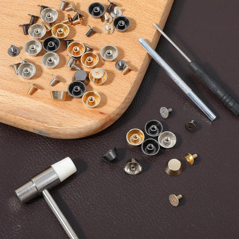 Collection of metal studs and screws from Snag This Solid Twenty Six Piece Purse Feet And Handbag Feet Metal Stud Rivet Kit.
