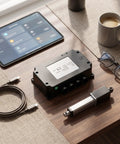 Heavy Duty Dual Motor Electric Actuator Controller With Wireless Remote And Wired Hall Sensor For Smart Home Furniture And Lifting Tables DC24V US Plug on a wooden table.