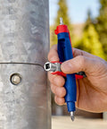 Hand using Pen Style Control Cabinet Key with Swivel Four Profile Heads, Eight And One Eighth Inch Long for gas shutoff