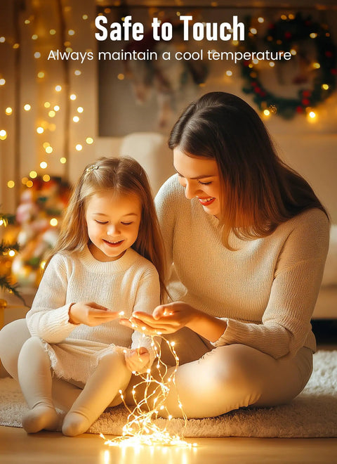 Mother and daughter enjoying Fairy String Lights 33 Ft Long Battery Operated 100 LED Copper Wire Twinkle Lights indoors.