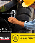Worker using Compact Pistol Grip Grease Gun With 3 Oz Cartridge Black Built For One Hand Operation Lightweight for a vehicle