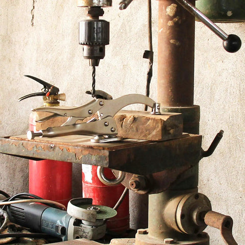 Heavy Duty 9 Inch Drill Press Locking Clamp For Precise Workholding visibly attached to a drill press, showing slot mount and quick release capabilities.