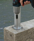 Installation of Titen HD Heavy Duty Screw Anchor For Concrete And Masonry, 5/8 Inch Diameter By 6 Inch Length in a post base.
