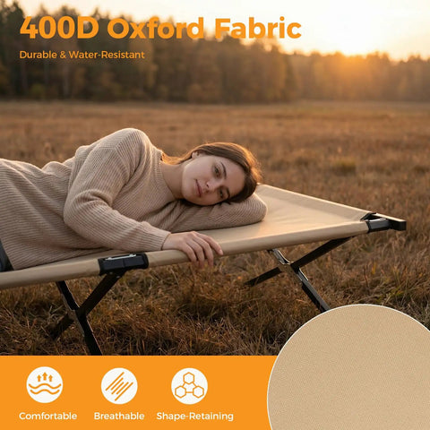Person lying on Extra Wide Camping Cot For Adults With 30.3 Inch Sleep Space No Squeeze Comfort Foldable Army Bed in field