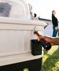 Close-up of bottle being opened with 125 Qt Gray Party Bar Wheeled Cooler with Ultratherm Insulation and beverage tub feature