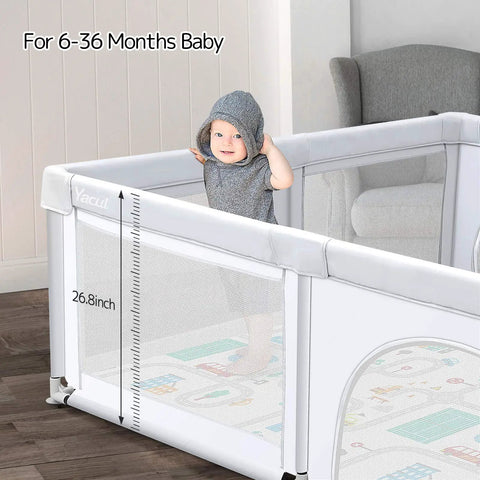 Baby in gray outfit playing inside Extra Large Baby Playpen With Mat 79 By 71 Inches For Toddlers And Infants Safety Gate Play Yard