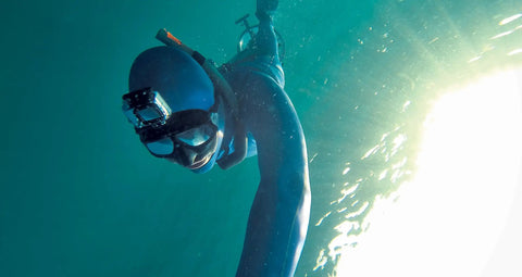 Diver using Dive Housing Bundle for HERO4 and HERO3 Series Action Cameras, Waterproof to 197 Feet, in underwater environment