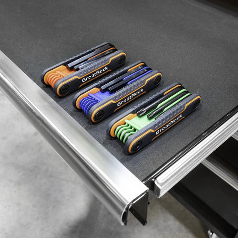 25 Piece Folding Hex Key Set SAE And Metric With Color Coded Bodies And Labeled Sizes Allen Wrenches on metal surface
