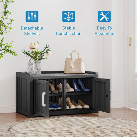 Two Tier Storage Bench Cabinet For Shoes Waterproof UV Resistant Outdoor Shoe Organizer With Two Doors And Adjustable Shelves Perfect For Indoor Outdoor Entryway Hallway And Living Room Black shown in a room with shoes inside