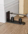 Adjustable Sliding Barn Door Floor Guide With Flat Bottom Design In Black 1 Piece Heavy Duty Steel Rail Nylon Roller installation
