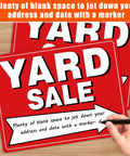 Front view of two red all-weather yard sale signs with white YARD SALE text, stacked on a wood surface