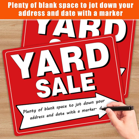 Front view of two red all-weather yard sale signs with white YARD SALE text, stacked on a wood surface