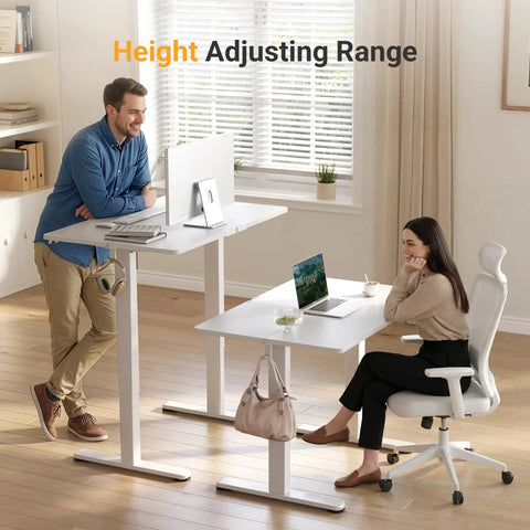 Two people using Electric Standing Desk With Three Memory Presets, 40 By 24 Inch Sit To Stand Desk, white frame in home office