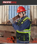 Top Notch Class 1 Black Safety Vest With Ten Roomy Cargo Pockets And 3M Reflective Straps worn by worker at a construction site.
