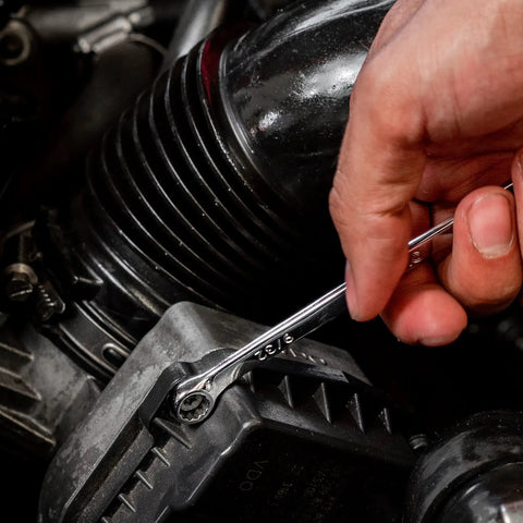 Hand using 15 Piece SAE Combination Wrench Set Built From Chrome Vanadium Steel With Precision 12 Point Box End For Maximum Torque And Slip Resistance Unbreakable Heavy Duty Wrench Set Built To Last For Frustration Free Auto And Home DIY on car engine bolt.