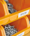 Close-up of labeled storage bins with screws, showcasing Rhino 4200 Industrial Label Maker With Fast Printing One Touch Hot Keys Rugged Build