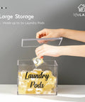 Premium Acrylic Laundry Pods Container With Lid, Clear Pod Holder for Tide Pods, being filled with detergent capsules