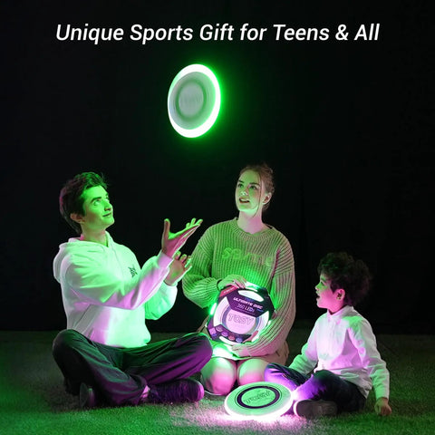 Three people playing with Rgb Led Flying Disc With 108 Multicolor LEDs Auto Light Up And Smart Modes Motion Sensor Waterproof Outdoor Frisbee.