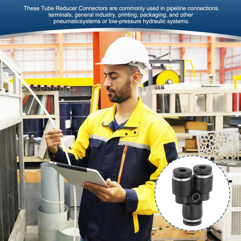 Engineer holding tablet with Six Pack Y Shape Push To Connect Fittings 1 8th Inch OD Tube Reducer in industrial setting