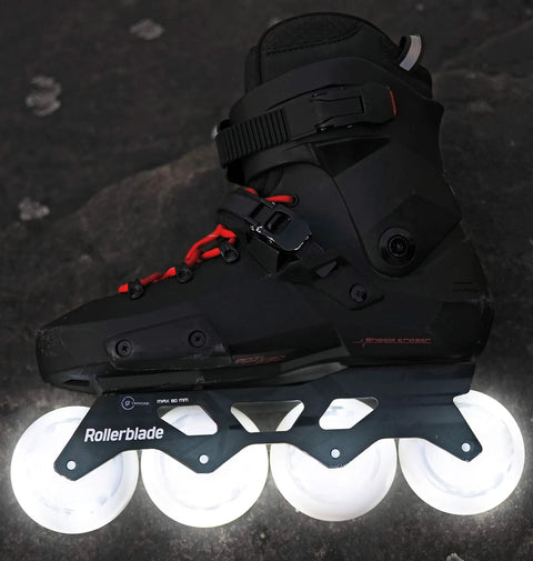 Moonbeam LED 80mm 82A Wheel Set 4 Pack For Inline Skates White With Glowing Night Visibility in action on black skate