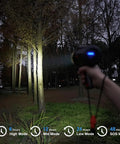 Person using 2000 Lumen Marine Spotlight Waterproof Rechargeable Handheld Flashlight For Boats With IP67 Rating in forest