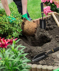 Gardener using 8 Piece Garden Hand Trowels Set With Pro Grade Heavy Duty Carbon Steel Shovels And Resin Rubberized Handles for planting.