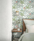 Bedroom scene with Boho Floral Peel And Stick Wallpaper Self Adhesive Contact Paper Waterproof For Bathrooms And Cabinets Removable Boho Chic Botanical Wall Covering 17.7 X 590.4 Inches on the wall, a bed with pastel bedding, and a wooden nightstand with decor.