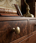 Close-up of dresser with 12 Pack Brushed Bronze Cabinet Knobs Set For Kitchen And Furniture Brass Zinc Alloy Drawer Pulls Single Hole Mount