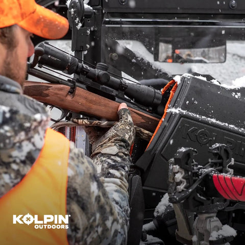 Hunter using Stronghold Gun Boot L With Autolatch Mount Black Hard Case For Long Guns Up To 52 Inches in snowy outdoor setting