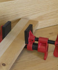 Three Quarter Inch Traditional Pipe Clamps For Woodworking And DIY Projects Incredibly Versatile And Easy To Assemble Workshop Clamp For Carpentry And Home Improvement The Go To Edge Gluing Clamp For Multi Piece Assemblies. 3/4-inch pipe clamp on wood panel