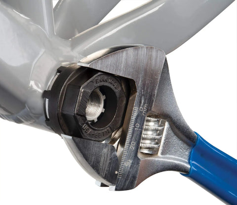 Bottom Bracket Tool BBT-18 For 8-Notch BBs, 43.4mm OD, bike maintenance in use with wrench