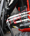 Hydraulic system of Mini Skid Steer Loader 1800 Lb Capacity With Four In One Bucket Attachment, detail view of pipes