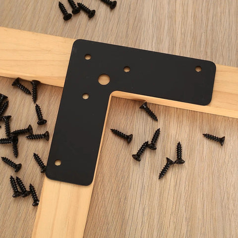 Beefy L Shaped Corner Brackets 4 By 4 By 1.25 Inch Pack Of 10 Black Steel Right Angle Mending Plates with screws on wood surface