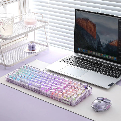 Smooth Wireless Mechanical Keyboard With Sleek Rotary Knob And Sick Tri Mode Sync For Effortless Multi Device Pairing Purple Crystal Switches, placed on a desk next to a laptop.