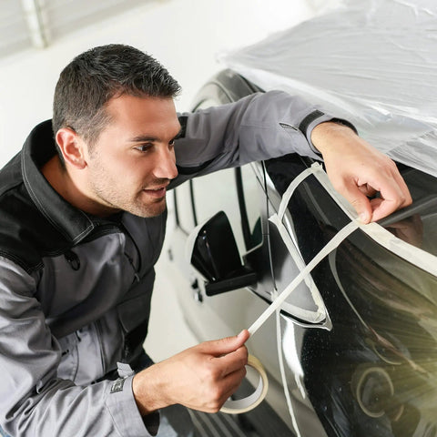Person using Beige 12 Pack Painter Tape 0.7 Inch By 50 Yards General Purpose Masking Tape For Painting on car window