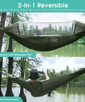 Two Person Pop Up Camping Hammock With Mosquito Net Lightweight Parachute Style Hanging Bed suspended between trees, reversible setup.