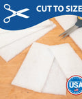 Top Notch 10 Pack Of 6 X 9 White Non Scratch Non Woven Buffing Pads For Wood Finishes and Wax Application displayed on wood surface, cut to size.
