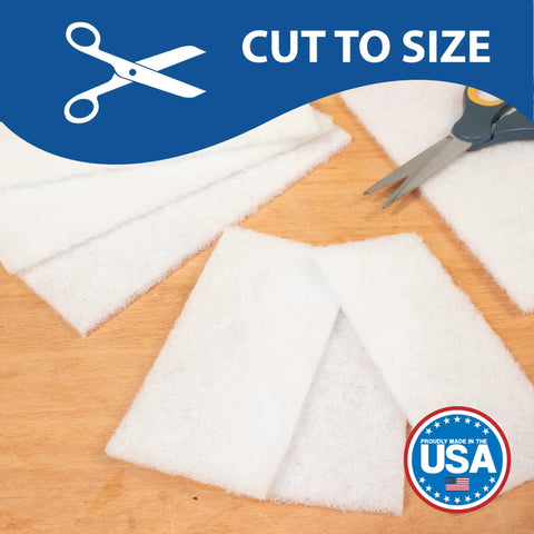 Top Notch 10 Pack Of 6 X 9 White Non Scratch Non Woven Buffing Pads For Wood Finishes and Wax Application displayed on wood surface, cut to size.