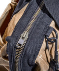 Close-up of the Waxed Canvas Tool Bag 15 Inch Heavy Duty Contractor Organizer With 19 Pockets, showing tan canvas and metal zipper.