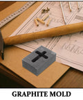 Graphite Cross Shaped Casting Mold for Melting Trusted by Jewelers High Precision Graphite Tool on workbench with hammer and plan