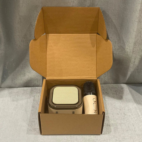 Rock Solid Brown Corrugated Shipping Boxes 6X5X3 Inches Bulk 28 Pack containing a speaker and microphone packaged securely.