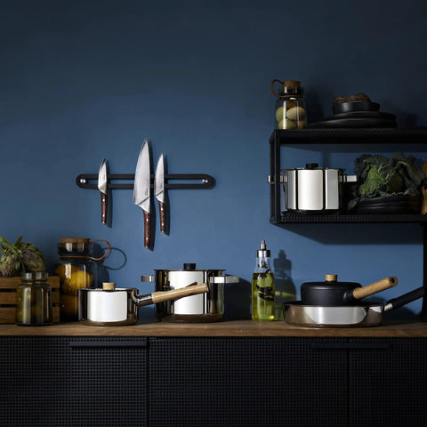 Kitchen with cookware including 8 inch stainless steel saute pan with nonstick Slip-Let coating induction compatible skillet on shelf.