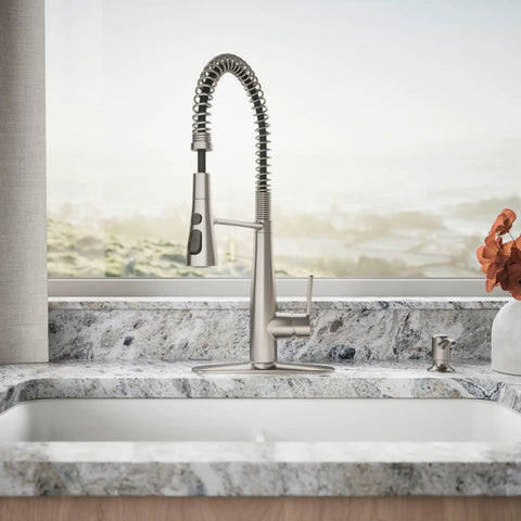 Slick Stainless Steel Kitchen Sink Faucet With Built In Soap Dispenser And Heavy Duty Pull Down Sprayer showcased on a granite countertop.
