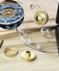 Brass router template bushing set, 13 pcs with centering cone; includes clear plastic sub-base and carrying case.