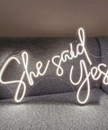 She Said Yes Neon Sign Led Light For Weddings And Parties White 60cm Bride Glow on grey sofa